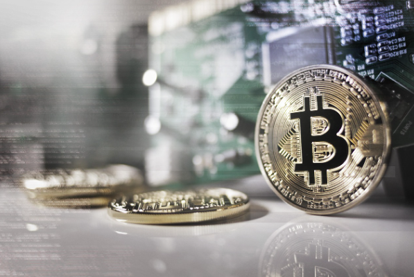 Bitcoin halving concept with physical Bitcoin coins and crypto mining background